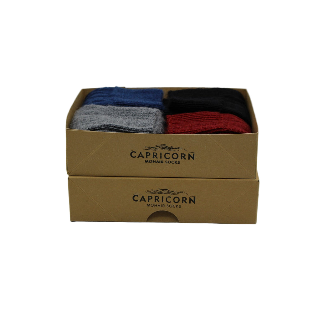 
                      
                        Box of Capricorn Surrey mohair socks – lightweight fine-knit ankle socks ideal for suits and everyday office wear
                      
                    