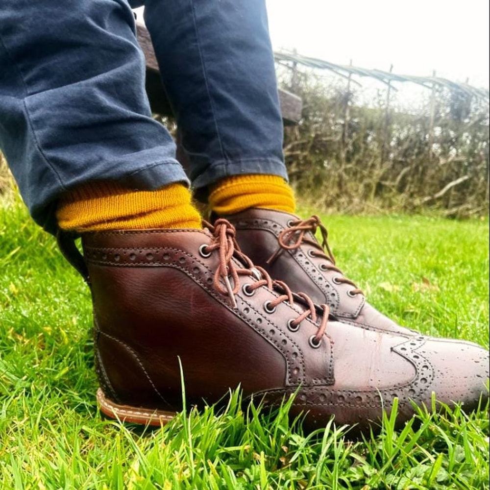 
                      
                        Mustard Surrey-style Capricorn Mohair Socks paired with smart leather boots – everyday luxury socks for comfort, style, and warmth
                      
                    