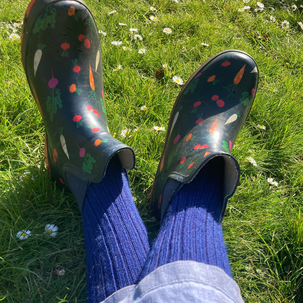 
                      
                        Oxford blue Yorkshire short-style Capricorn Mohair Socks worn with colourful gardening clogs – breathable, durable socks for outdoor work and leisure
                      
                    